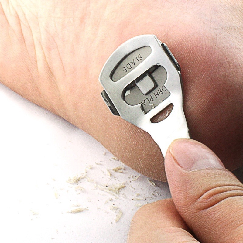 Using a razor to clearance remove dead skin from feet