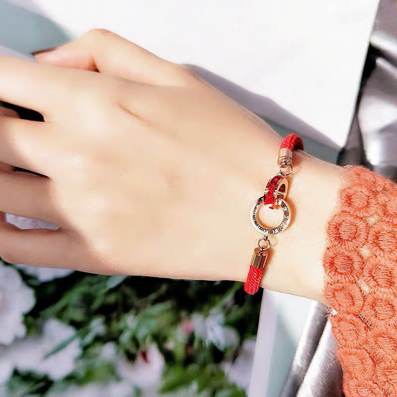 Red string clearance bracelet with gold