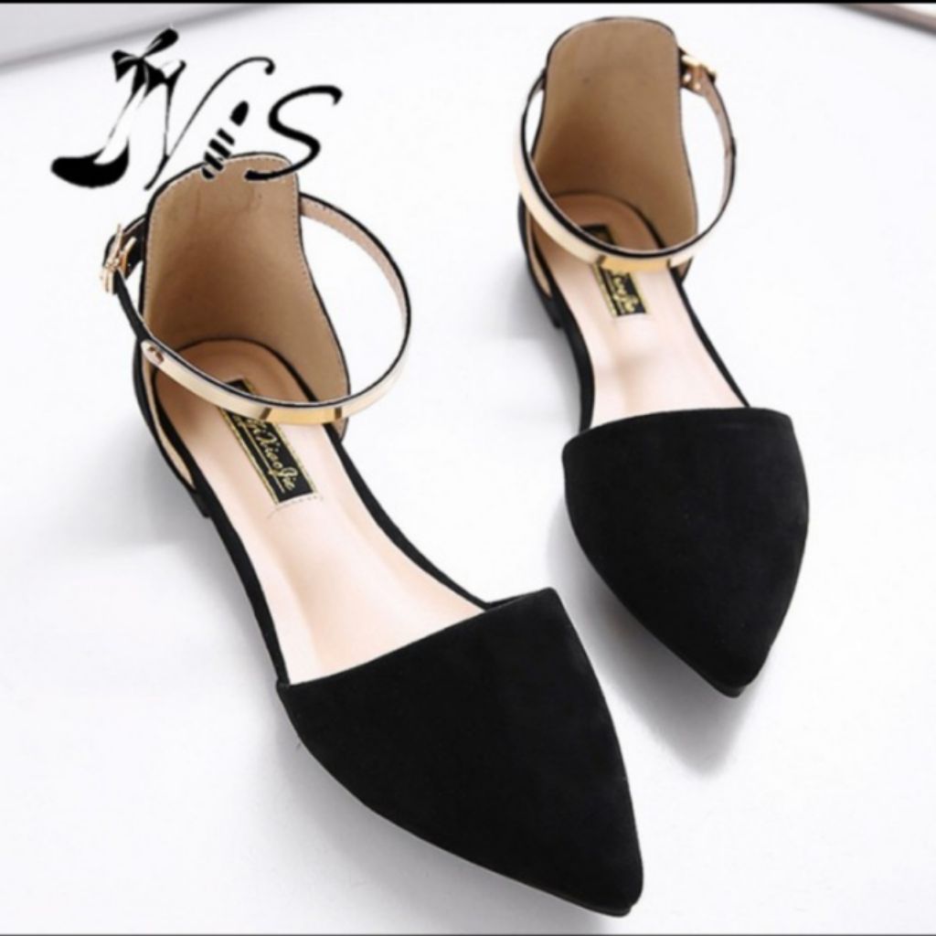 Black pointed flats with ankle clearance strap