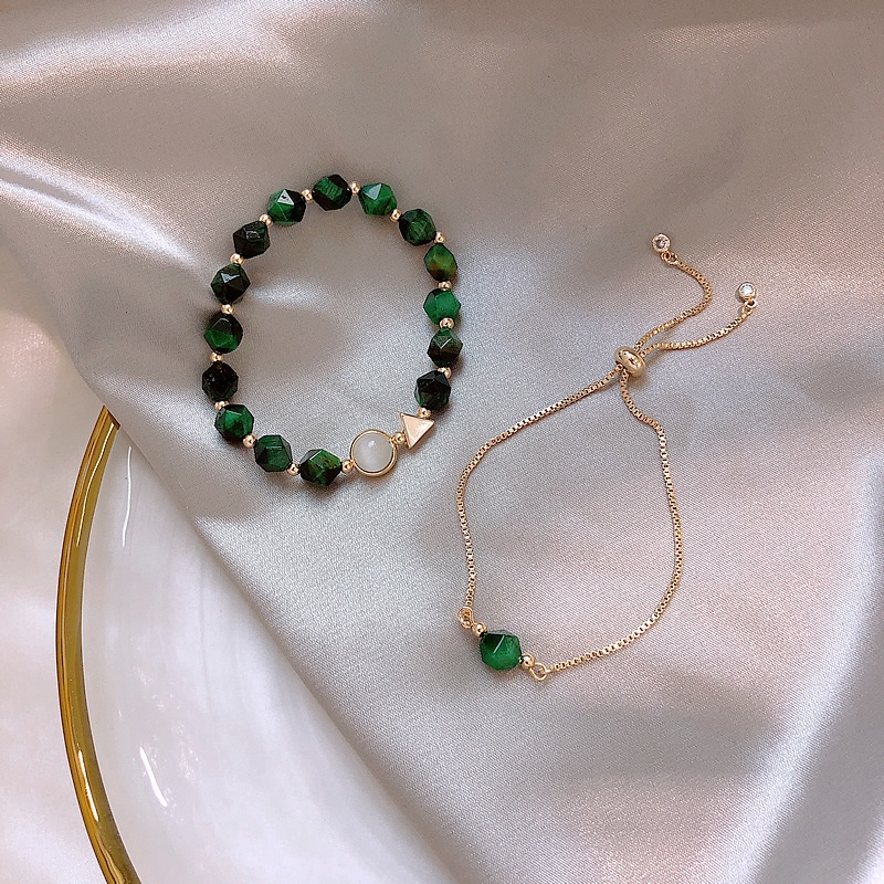 Gold bracelet with 2025 green stone