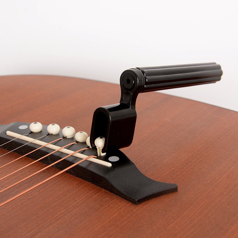 Guitar capo - enya with bridge pin remover