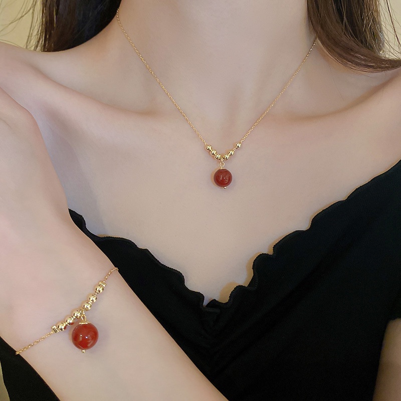 Gold chain with hot sale red stone