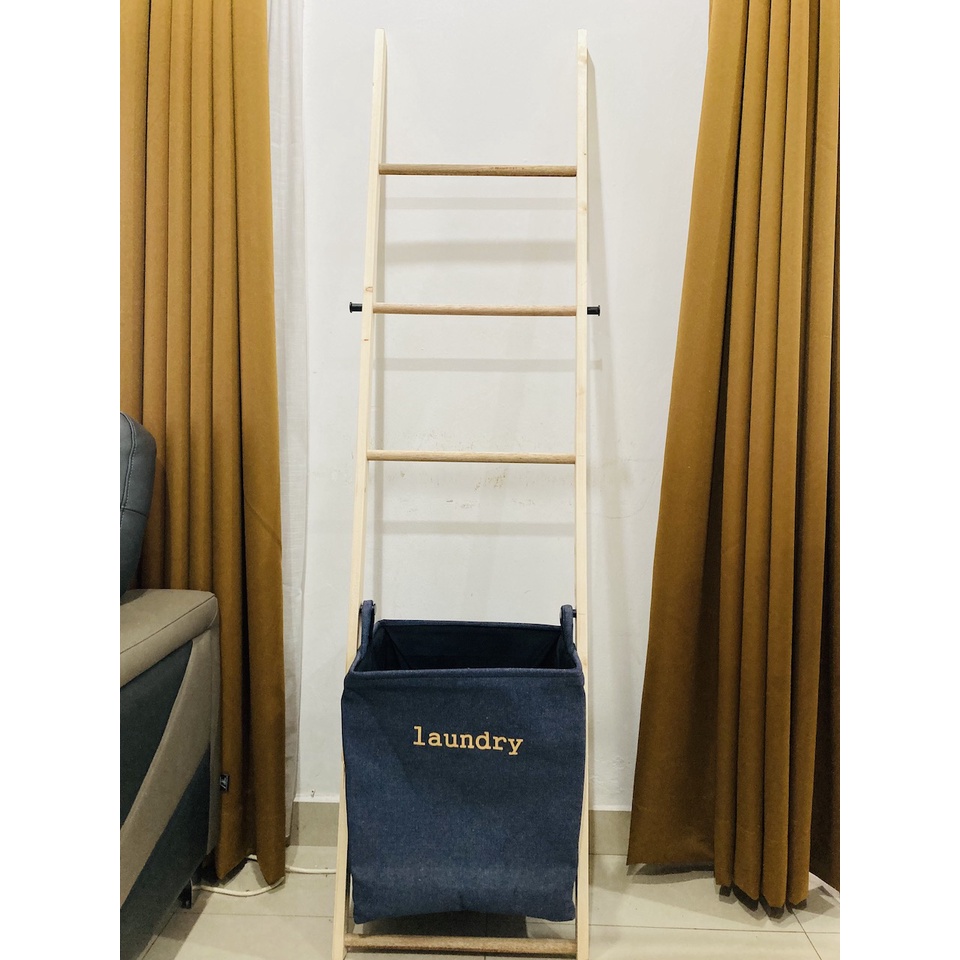 Wooden ladder rack and towel hanger with laundry bag. Scandinavian