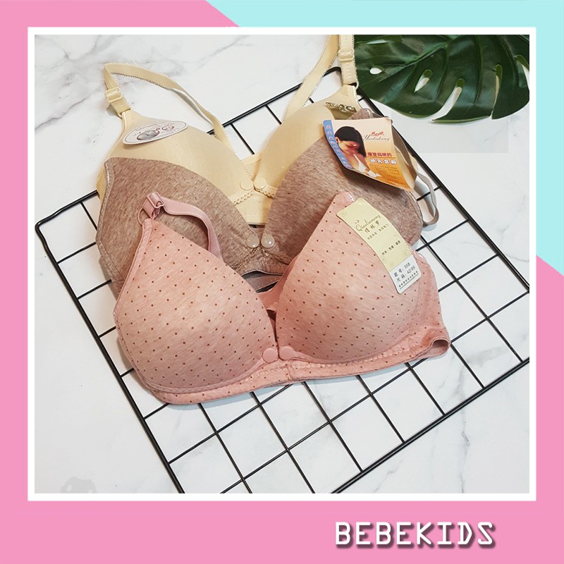 Convenient push-button nursing and maternity bra - Open button ...