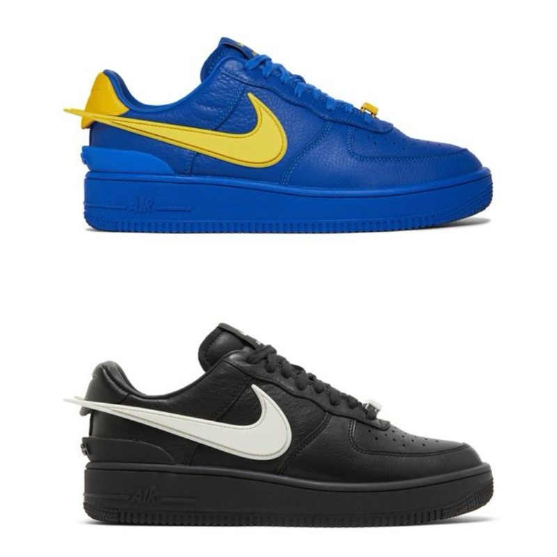 Nike air force 1 black with yellow on sale swoosh