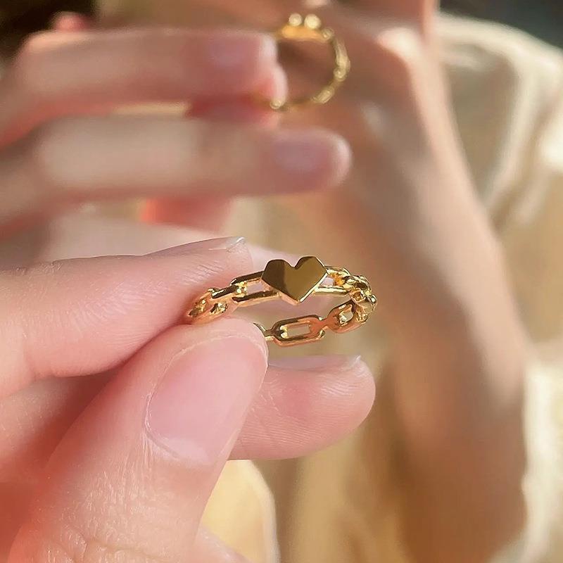 Gold ring in heart on sale shape