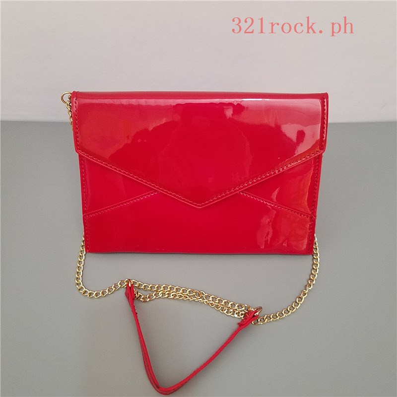 Red patent leather clutch on sale bag