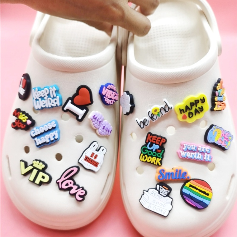 White crocs hot sale rainbow words