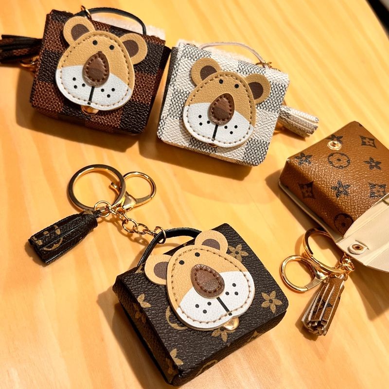 Suitable for Lv Bag Fashion Brand Old Flower Lion Bluetooth Headset Storage Bag Creative Coin Purse Car Key Pendant Gift