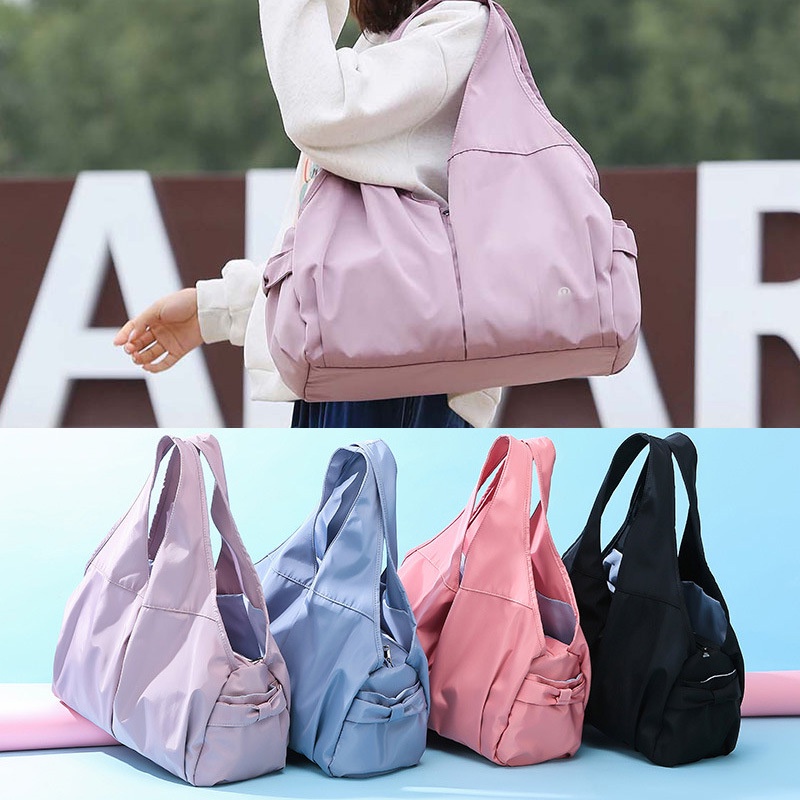 Lululemons oneshoulder tote messenger travel duffel bag wet and dry