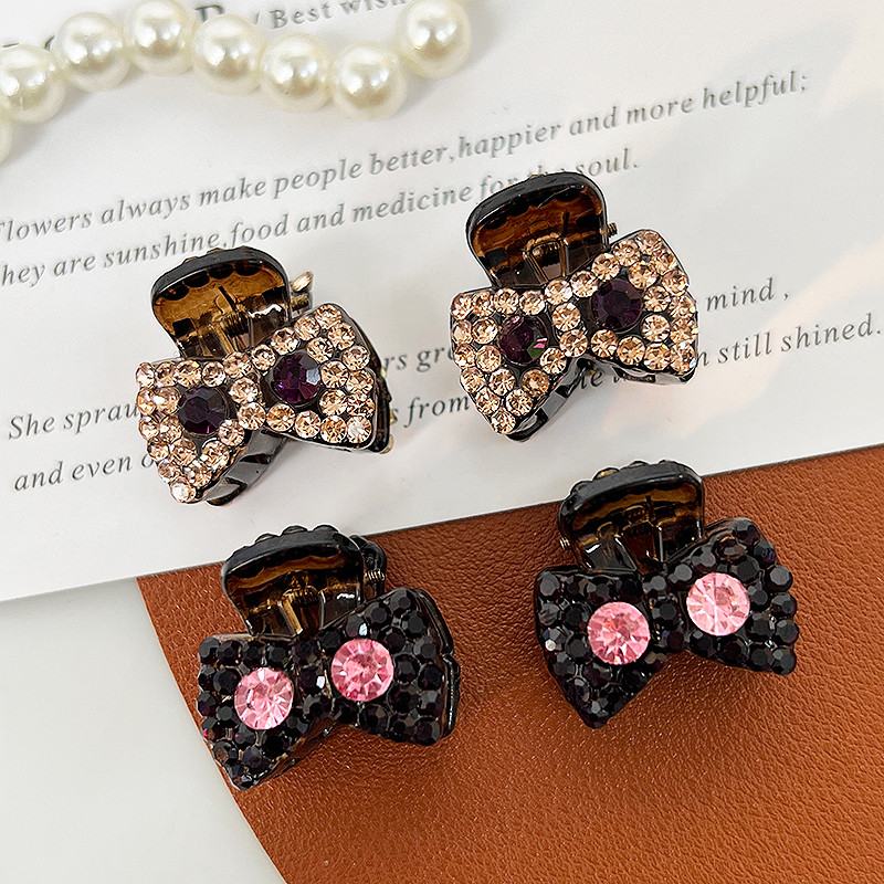 A pair of sparkling diamond mini bow princess head small grab clip ...