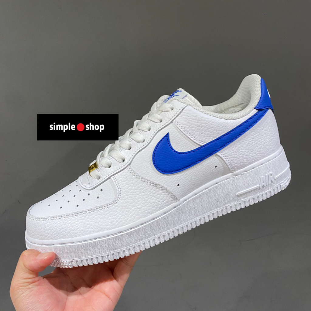 Nike air force 1 hot sale black with blue swoosh