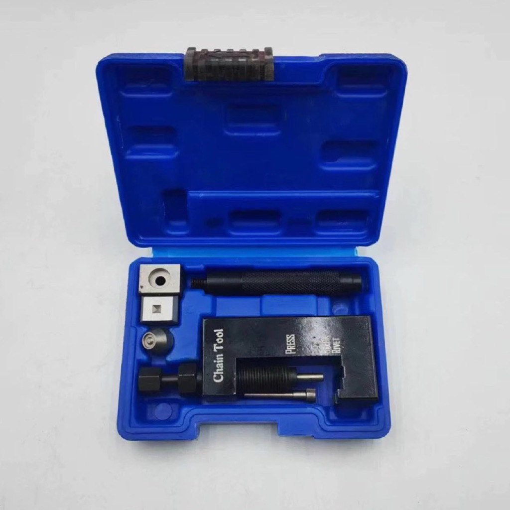 Tool for removing, cutting, pressing, and riveting chain links ...